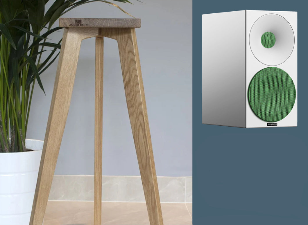 Amphion Helium410 desktop loudspeaker stands in oak finish, shown in a home setting. The stand heights are adjustable from 140-900mm.