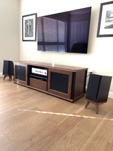 Load image into Gallery viewer, Wooden entertainment console with audio chic drunken snipe speaker stands in a room setting