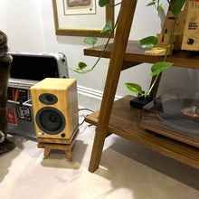 Load image into Gallery viewer, Wooden audioengine A5+ speaker on a snipe speaker stand with isolation plinth by audio chic next to a record player on a wooden shelf.