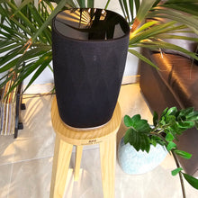 Load image into Gallery viewer, B-and-W-Formation-Flex-Egret-speaker-stand-in-Walnut-by-audio-chic against a plant and sofa