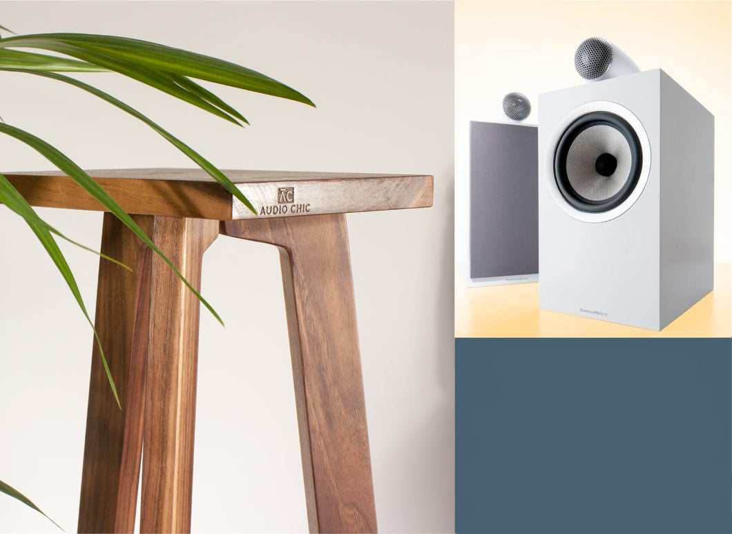 Speaker stand made of wood, with a speaker on top, displayed in a room setting. The stand has a tripod design and in Walnut. Available in a range of heights.