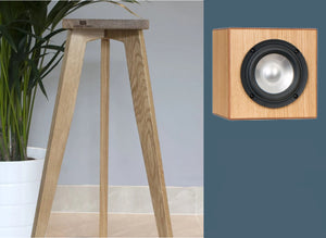 An image showing a pair of DMAX Audio Super Cubes 5 speaker stands. The stands are made of oak and are available in varying heights from 140-900mm, with a cube-shaped speaker.