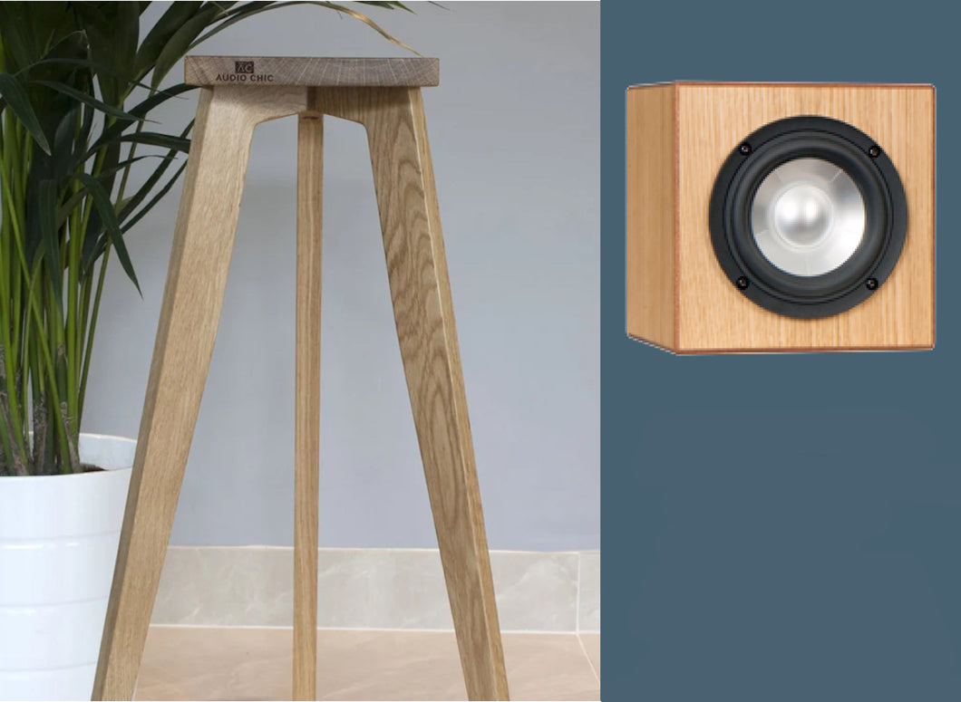 An image showing a pair of DMAX Audio Super Cubes 5 speaker stands. The stands are made of oak and are available in varying heights from 140-900mm, with a cube-shaped speaker.