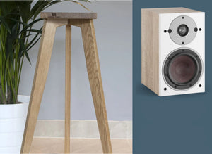 A Dali Oberon 1 speaker stands with oak wood finish. One stand is shown with a speaker, in a range of heights from 140-900mm.