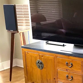 Dynaudio-special-40th-Anniversary-Edition-Speaker-stand-by-audio-chic_copy and Television on a stand with a wooden cabinet below