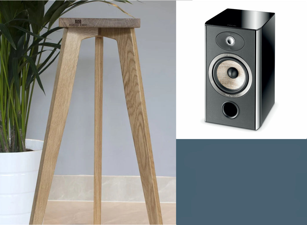 Speaker stand made of wood, designed for Focal Aria 906 speakers, featuring a shaped top plate. The stand is displayed in a room setting.