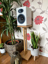 Load image into Gallery viewer, White speaker on a harmony speaker stand by audio chic with decorative plants and floral wallpaper in the background