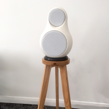 Load image into Gallery viewer, White JERN-15-on a trip pod crane-speaker-stands-in-oak-by-audio-chic against a white wall.