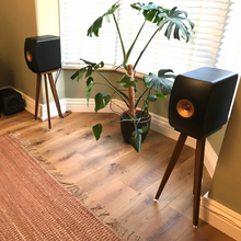 Load image into Gallery viewer, KEF-LS50-Wireless-650-Oak-speaker-stands-by-audio-chic in a room with a plant