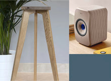 Load image into Gallery viewer, A pair of wooden speaker stands designed for KEF LSX II speakers, showing the stands in a room setup and a close-up of the stand&#39;s design with Audio chic logo.