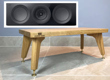Load image into Gallery viewer, Wooden centre speaker stand with &#39;Audio Chic&#39; branding next to a close-up of speakers on a grey background