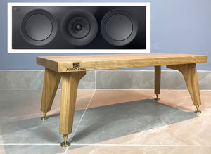 Wooden centre speaker stand with 'Audio Chic' branding next to a close-up of speakers on a grey background