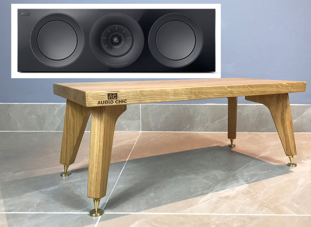 Wooden centre speaker stand with 'Audio Chic' branding next to a close-up of speakers on a grey background