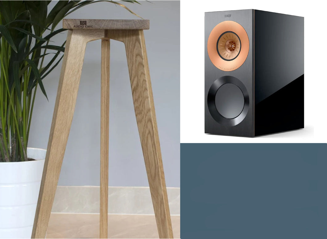 A pair of speaker stands designed for KEF Reference 1 Meta speakers, showing a single stand in an oak finish alongside the speakers. The stands are in a range of heights, from 140-900mm.