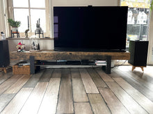 Load image into Gallery viewer, Klipsch-The-Nines-Speaker-stands-by-audio-chic in a Living room with Christmas decor a large TV on a wooden stand, surrounded by decor items.