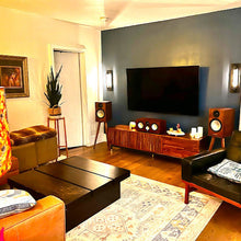 Load image into Gallery viewer, Stylish and modern Living room with a television, speakers, and decorative items. With the Monitor-Audio-Silver-100-Bittern-Speaker-Stand-by-audio-chic