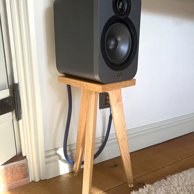 Q-Acoustics-3020-Speaker-stand-by-audio-chic-against a white wall.