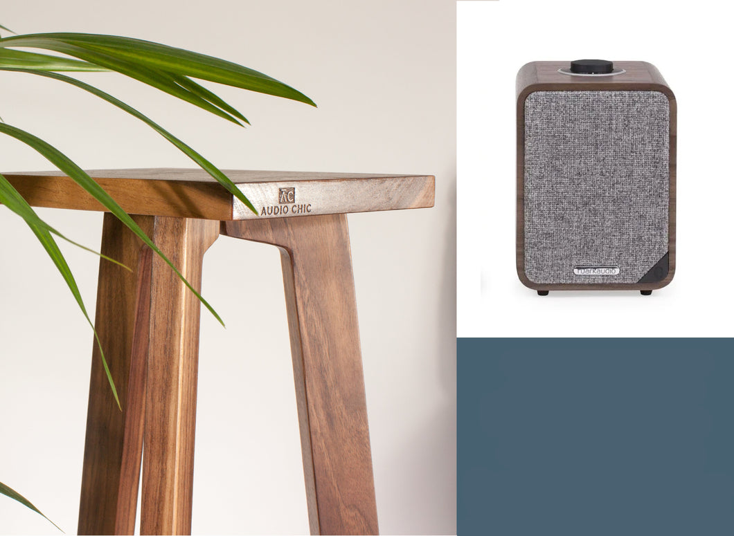 Ruark MR1 Mk2 bluetooth speaker with a walnut tri-leg speaker stand with the audio chic logo brand on the front