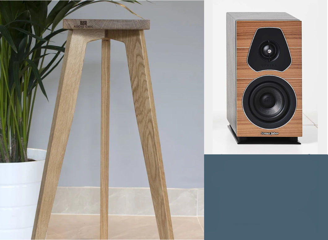 Sonus faber lumina I speaker and speaker stand in oak. The tri leg design displays the Audio Chic logo on the front.