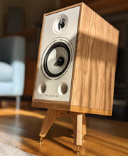 Load image into Gallery viewer, Triangle-Borea-BR03-drunken-snipe-speaker-stand-in-oak-by-audio-chic in a stylish room setting.