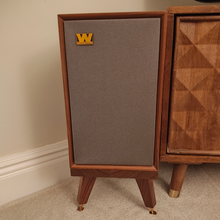 Load image into Gallery viewer, Wharfedale-Denton-80-snipe-speaker-stand-in-Walnut-by-audio-chic on a beige wall and carpeted floor