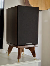 Load image into Gallery viewer, Wharfedale-Diamond-12.2-kite-speaker-stands-by-audio-chic next to a guitar on the wall.