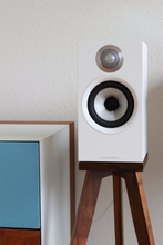 Load image into Gallery viewer, B&amp;W 607, 607 S2 and 607 S3 speaker stands in walnut in a living room