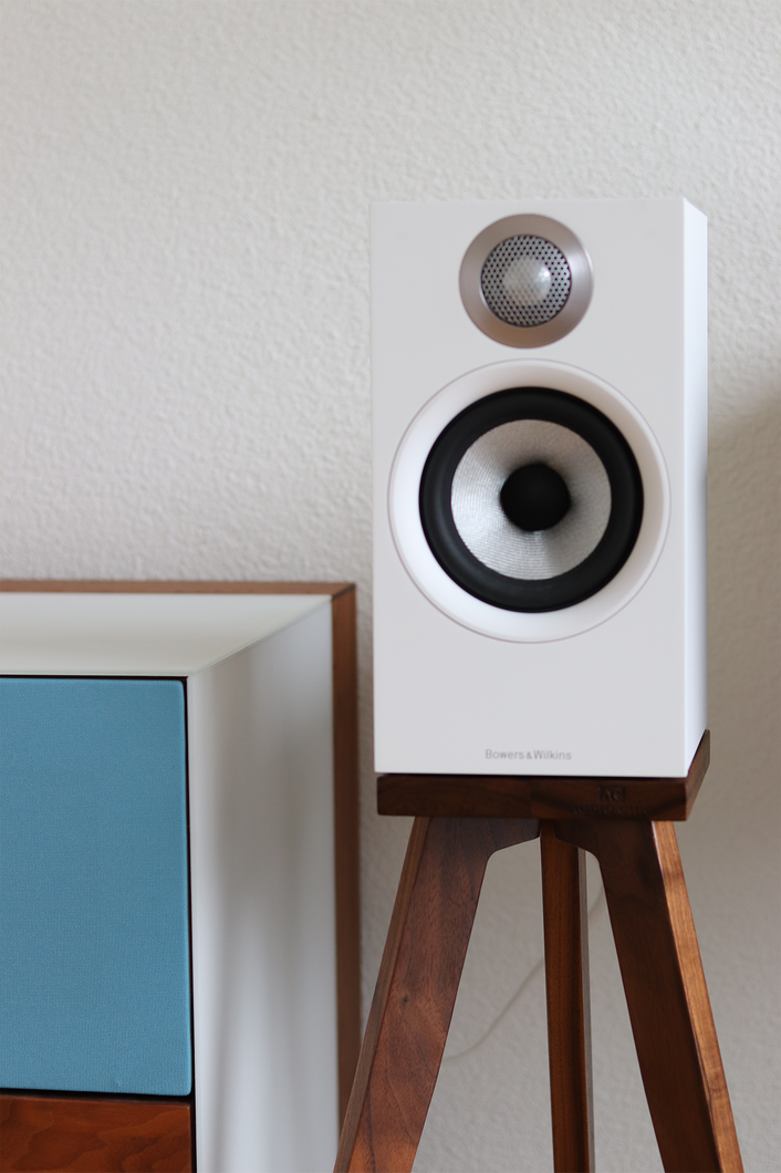 B&W 607, 607 S2 and 607 S3 speaker stands in walnut in a living room