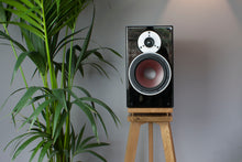 Load image into Gallery viewer, Lifestyle shot of Audio Chic Solid Oak Speaker Stand with Extra Layer of Isolation