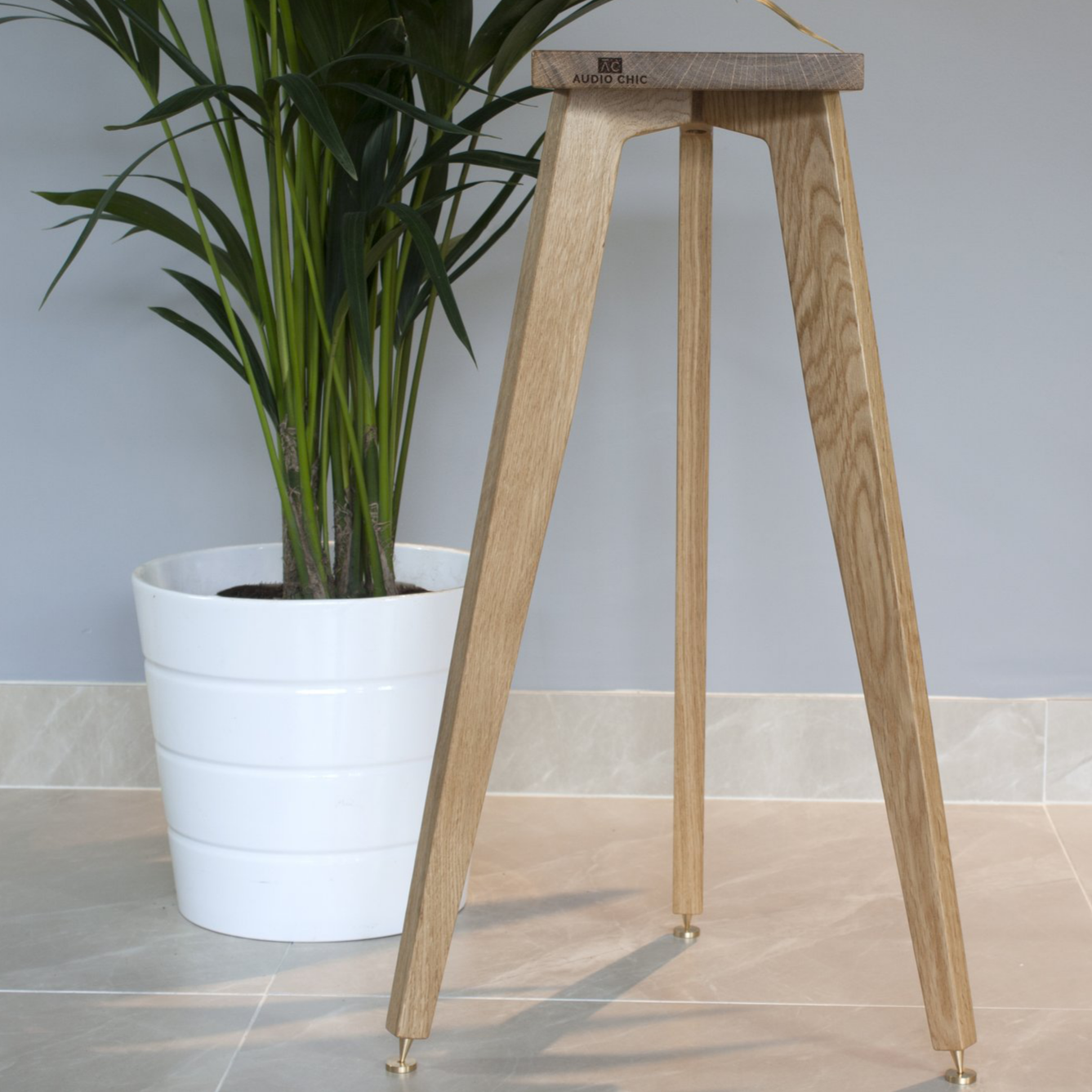 The Heron Tripod Hardwood Bookshelf Speaker Stands tall with speaker spikes and shoes